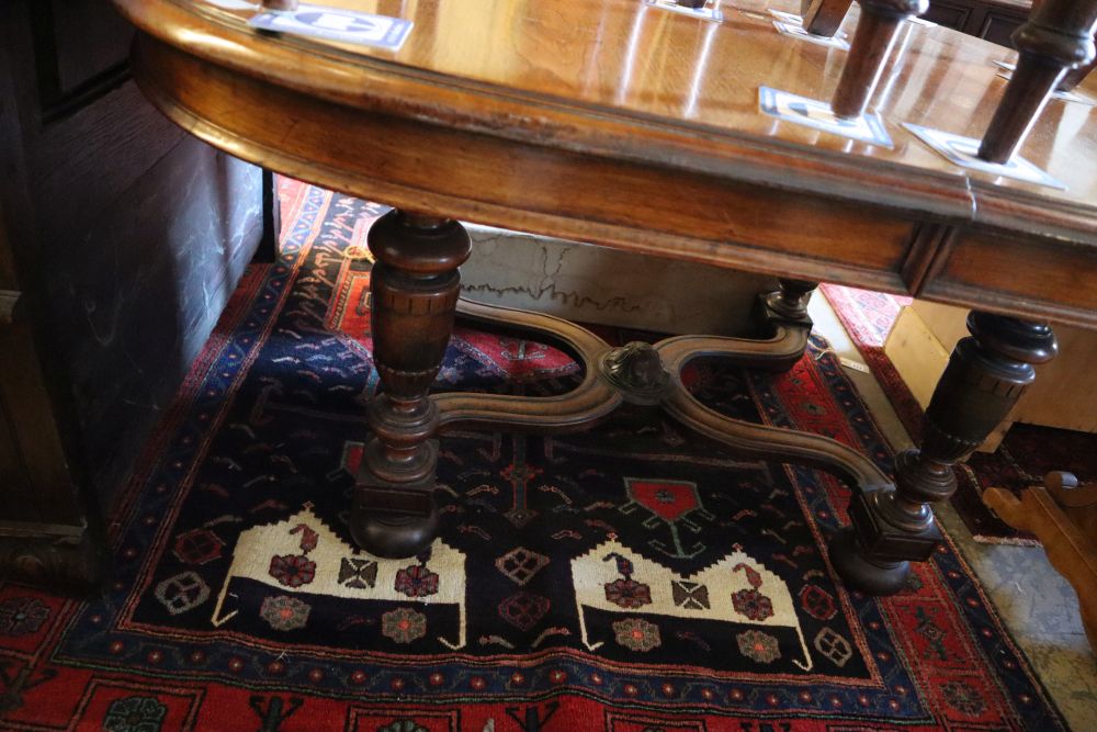 A late 19th century Continental walnut extending dining table, width 140cm, depth 124cm (no leaves) and four chairs